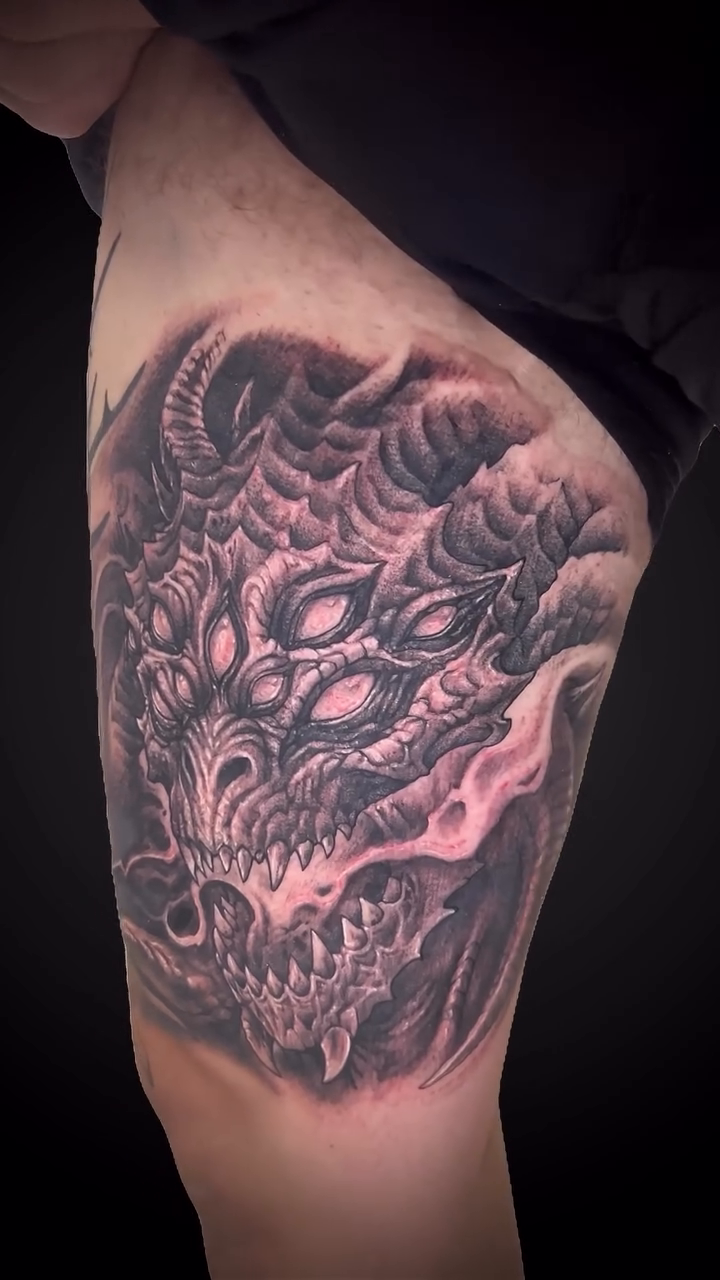 Demonic creature face dark art tattoo on the shoulder by Daniel Fisher, Berlin, New Jersey