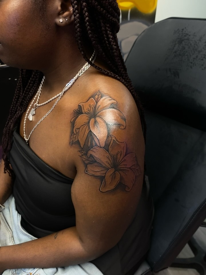 Lilies fine line tattoo on the shoulder by Mariš¤, Chicago, Illinois
