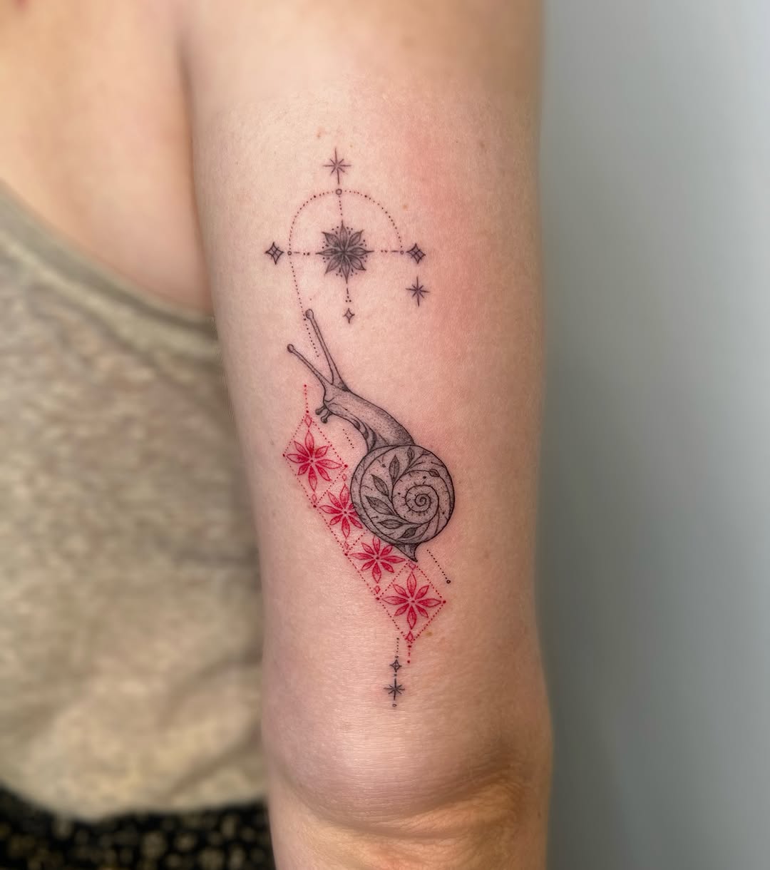 Snail with geometric and floral elements ornamental tattoo on the forearm by 𝒜𝓇𝓉𝒾𝓈𝓉 𝒟𝒶𝒾𝓈𝓎 ♡