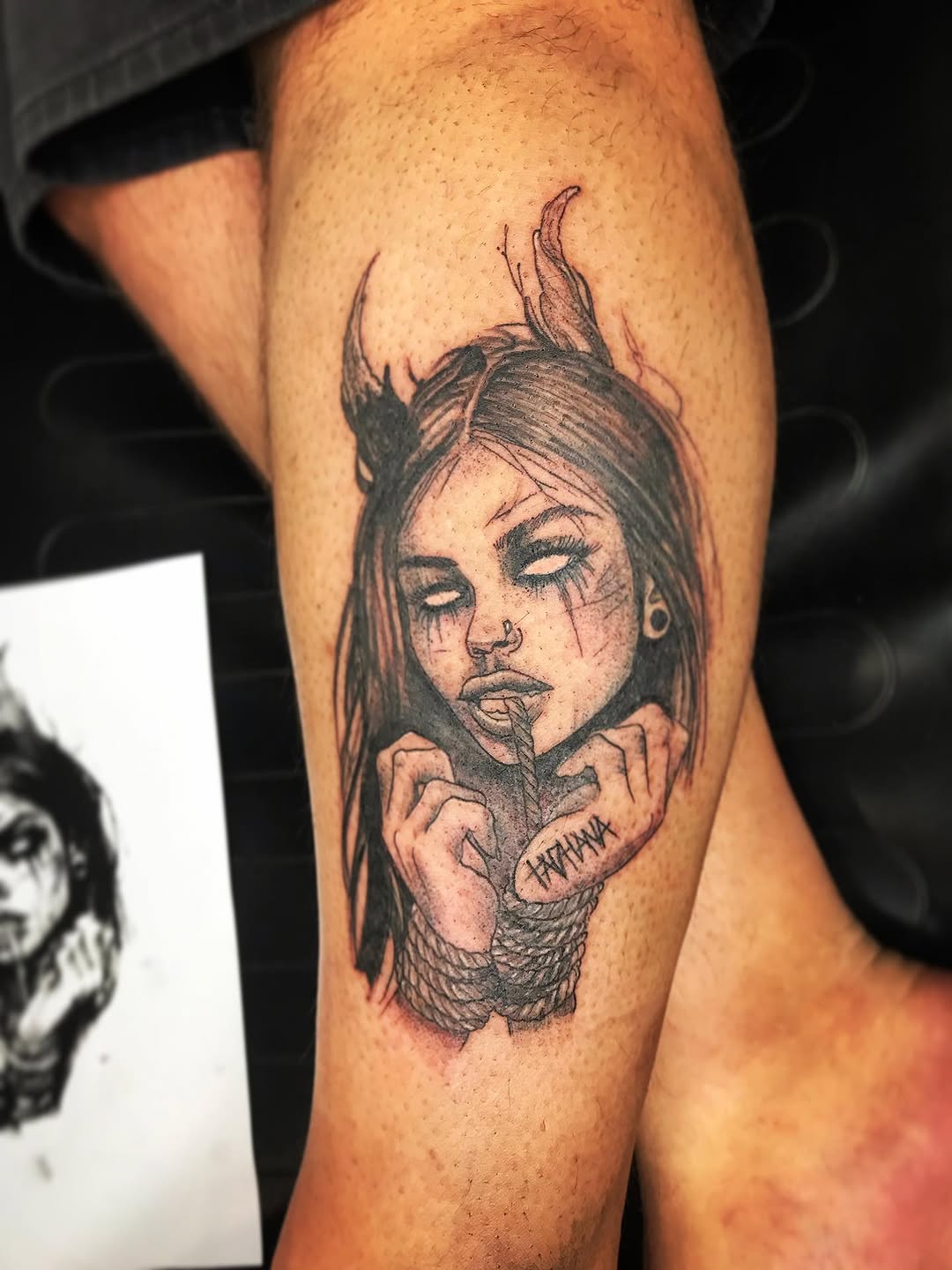 Demon girl with horns realism tattoo on the forearm by Moss Quito Tattoo