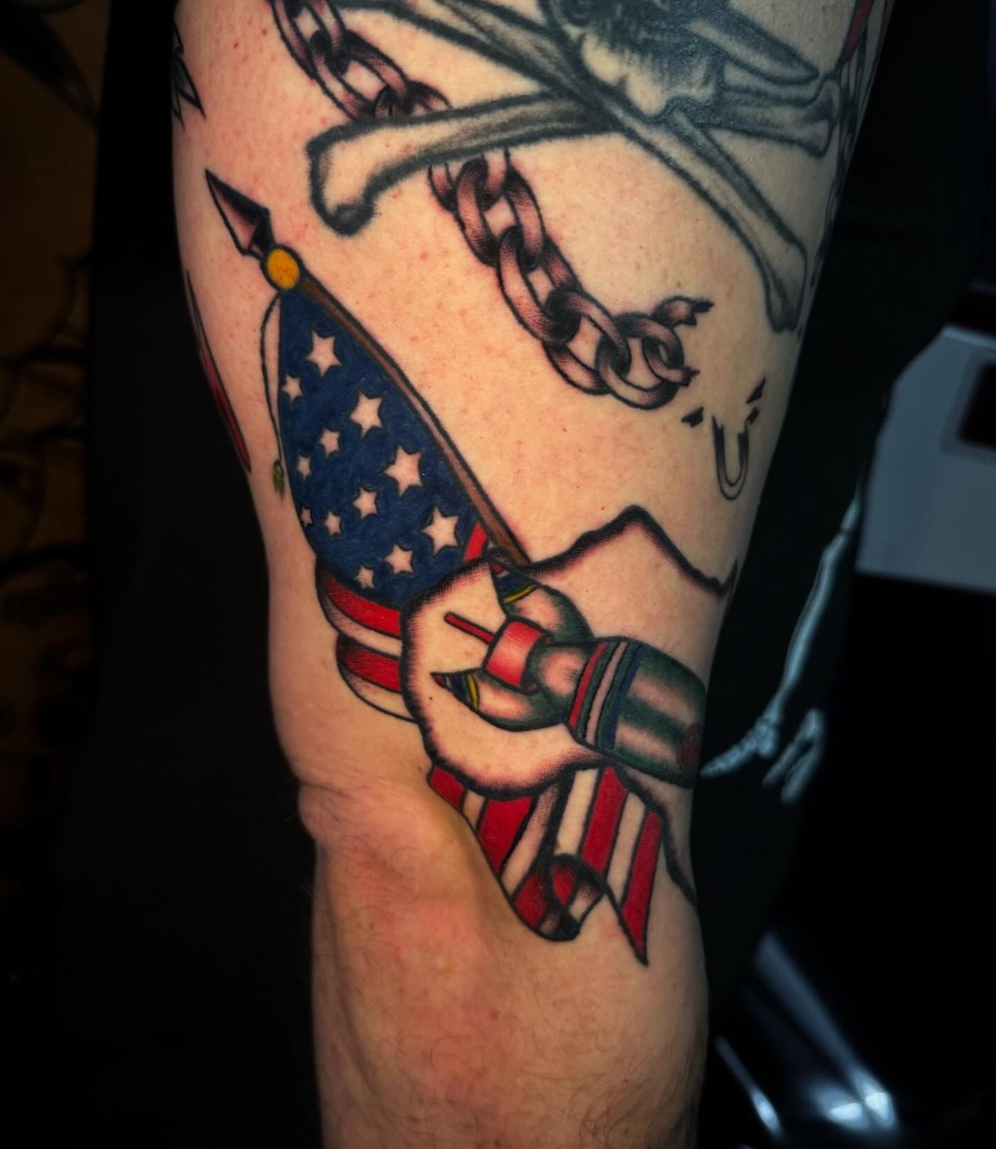 American flag and chains American traditional tattoo on the forearm by Lydia