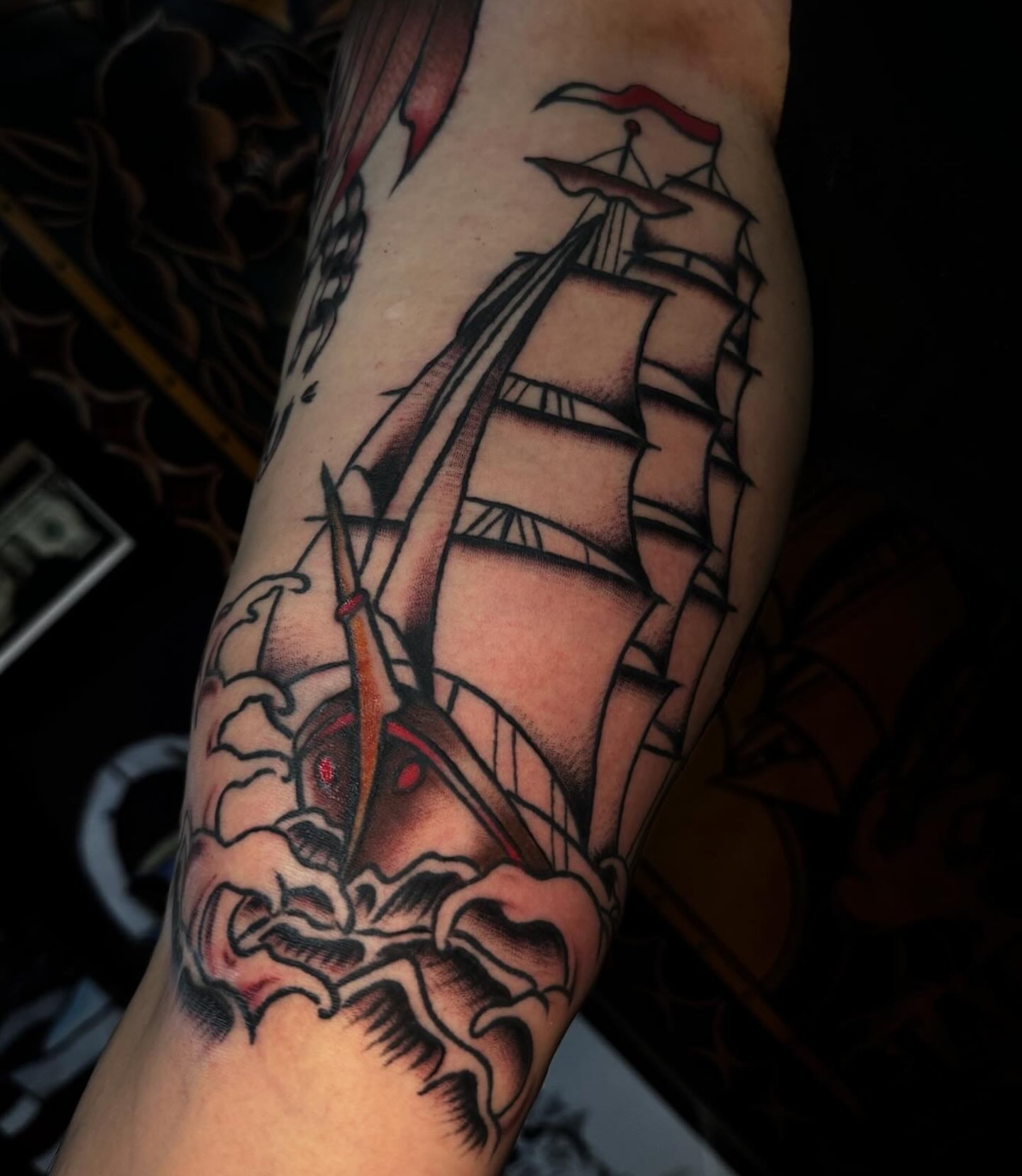 Ship sailing through waves American traditional tattoo on the forearm by Lydia