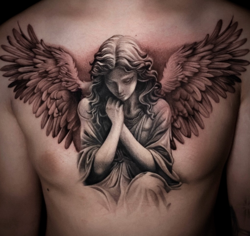 Angel with wings realism tattoo on the chest by D A N N y L I N