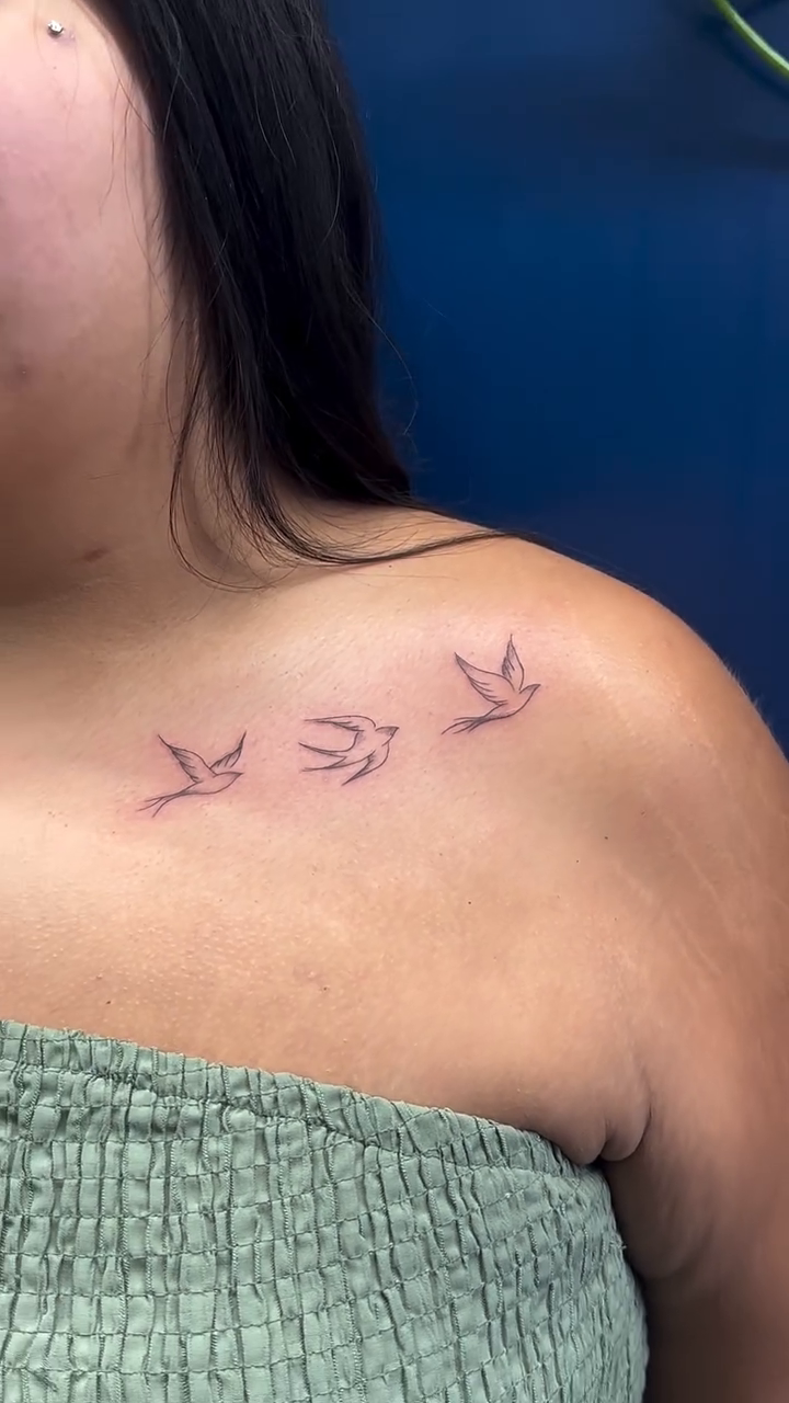 Flock of birds fine line tattoo on the chest by Tattoo Takayo