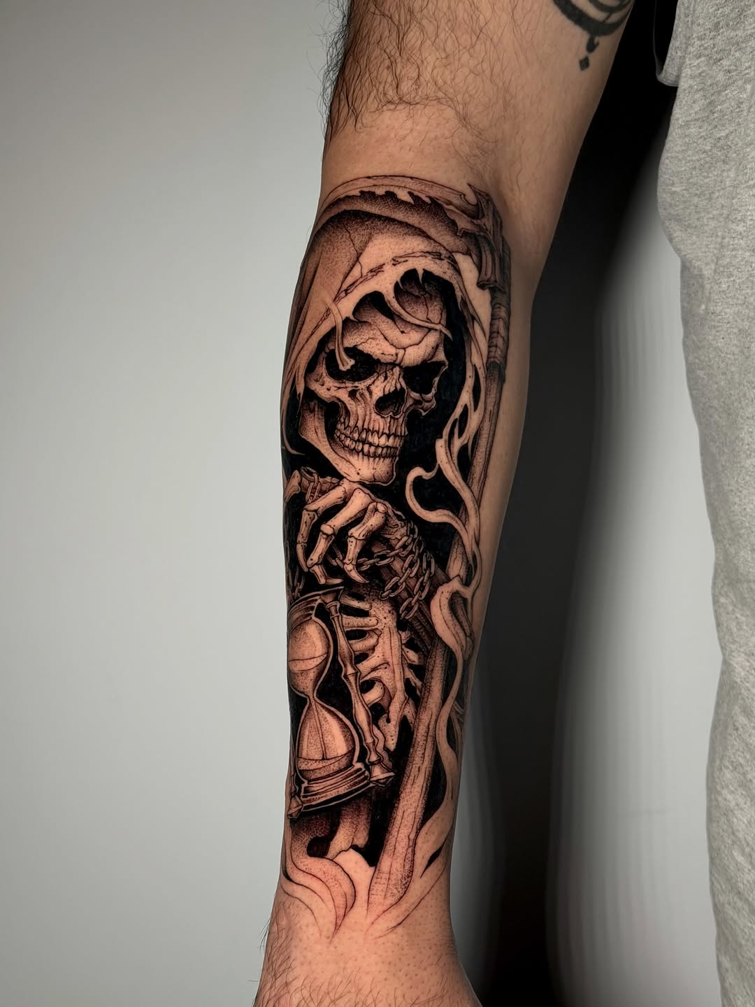 Grim reaper with hourglass realism tattoo on the forearm by Kbtattz
