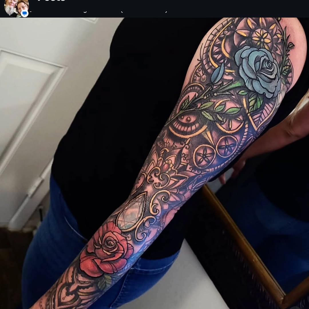 Roses and ornamental patterns ornamental tattoo on the forearm by Shane Watkins