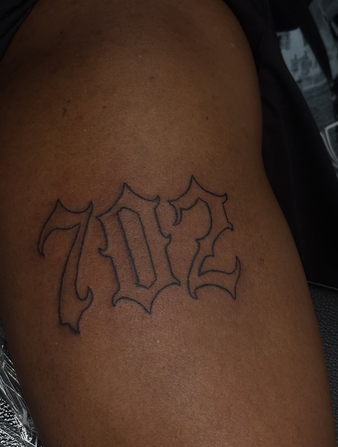 Numbers 702 Chicano tattoo on the shoulder by Las Vegas Tattoo Artist ๐ฒโ๏ธ
