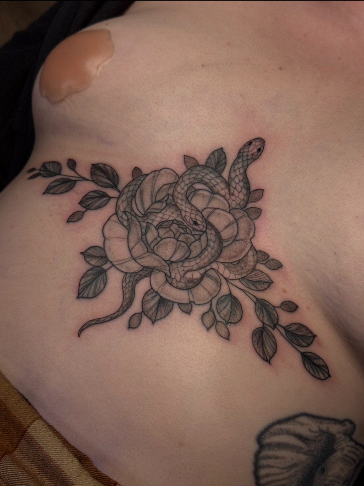 Snake and rose black and grey tattoo on the shoulder by jess jené jones, Portland, Oregon
