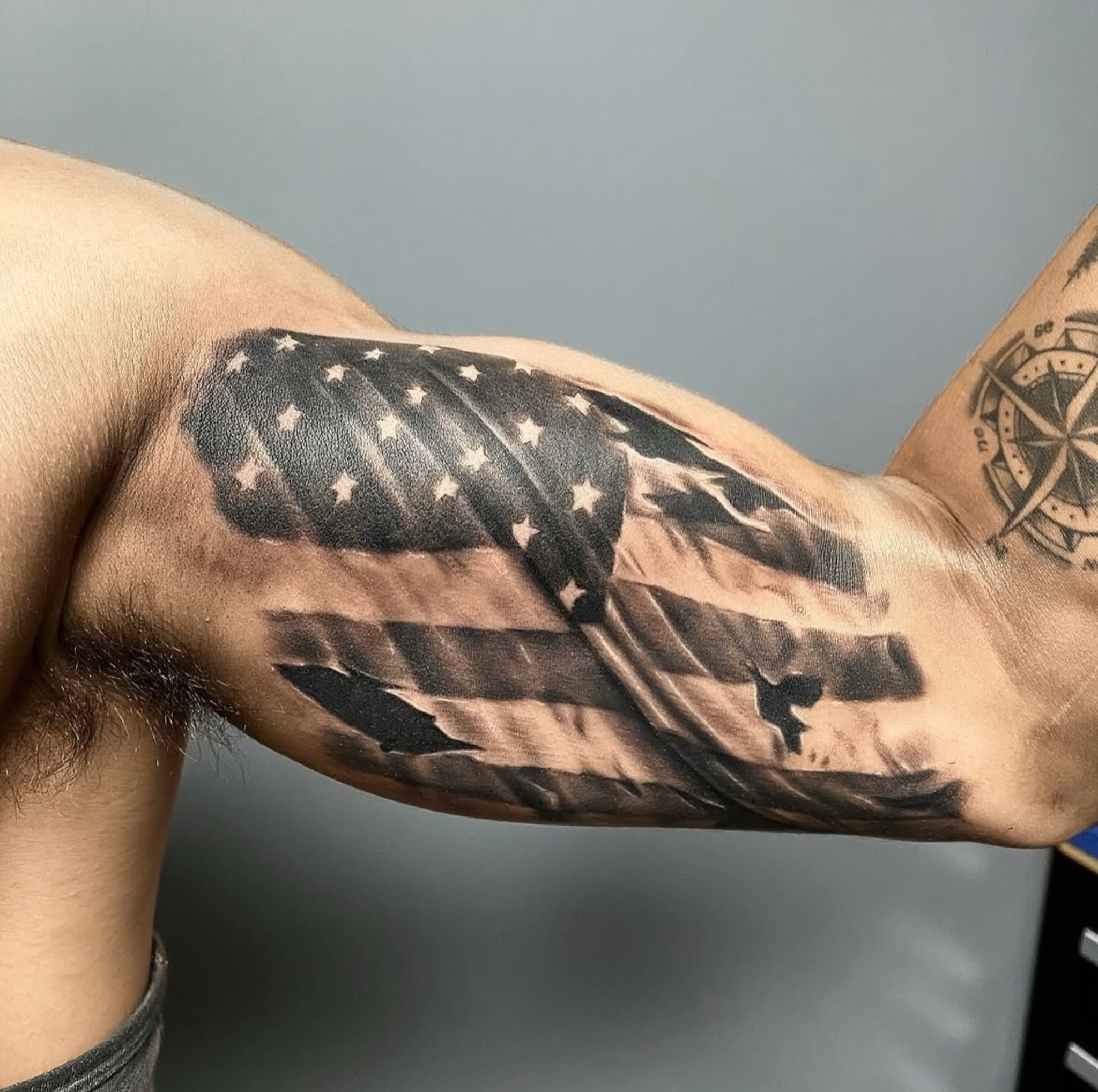 American flag realism tattoo on the forearm by Tattoos by Anthony Davis