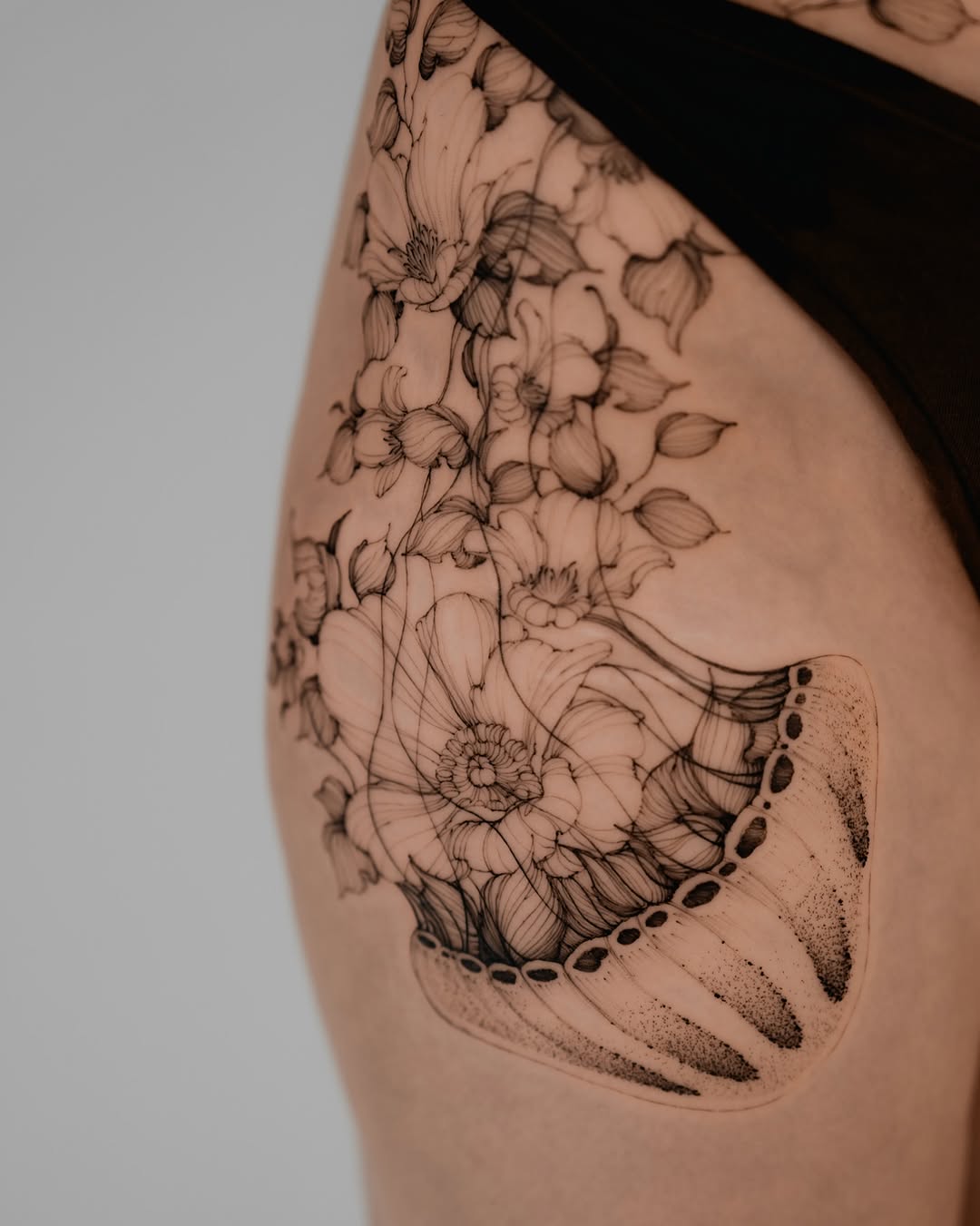 Jellyfish and flowers sketch tattoo on the shoulder by Marek