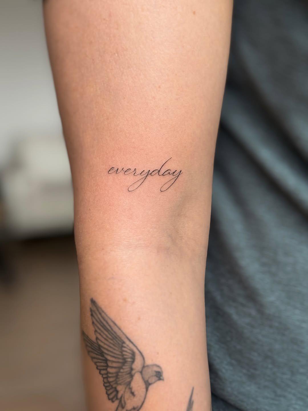Script lettering lettering tattoo on the forearm by Victoria