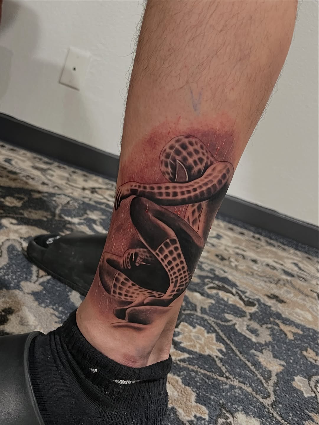 Sad Spiderman surrealism tattoo on the forearm by Dallas tx tattoo artist ✝️