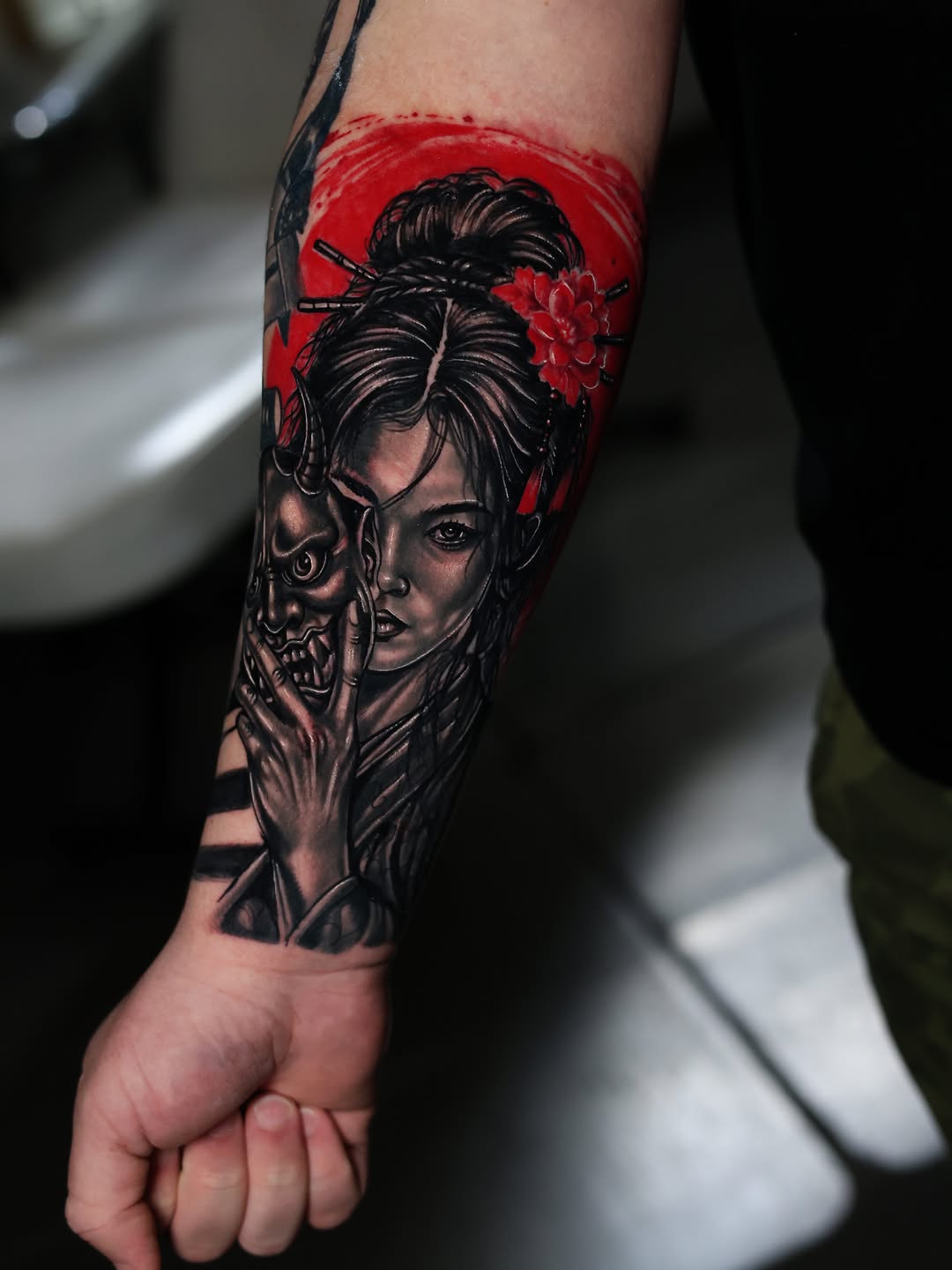 Geisha with mask Japanese tattoo on the forearm by Insight Ink Tattoo
