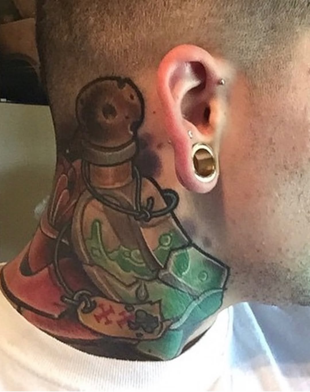 Potion bottle American traditional tattoo on the neck by James ⚡️ Tattoo Artist
