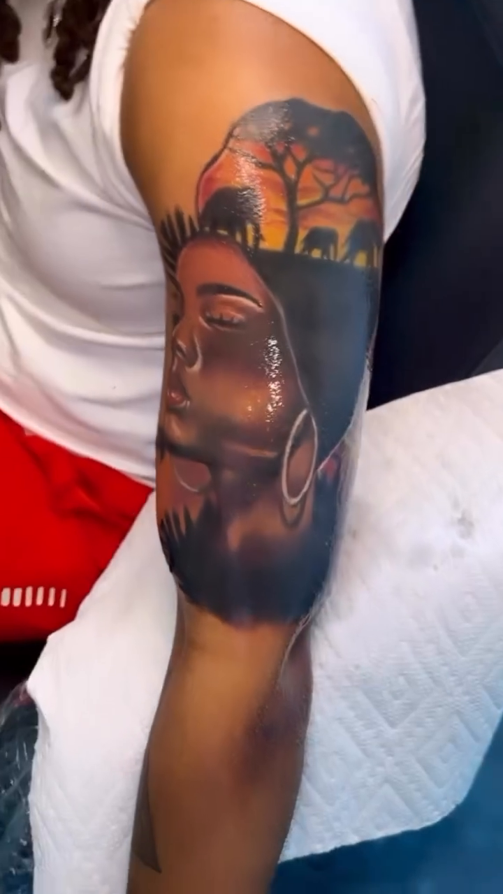 Chicano tattoo on the upper arm by Inkby_larry