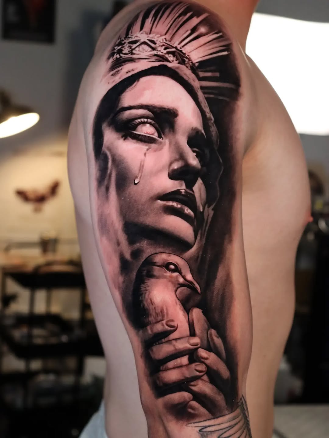 Woman's face with a dove Chicano tattoo on the forearm by Miami Florida Tattoo Artist