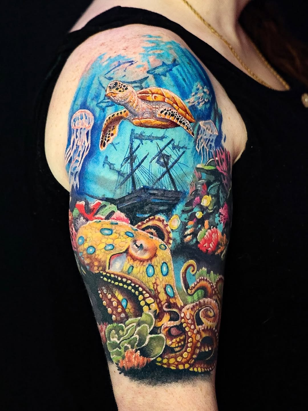 Watercolor tattoo on the upper arm by Matt Trimble, Charlotte, North Carolina