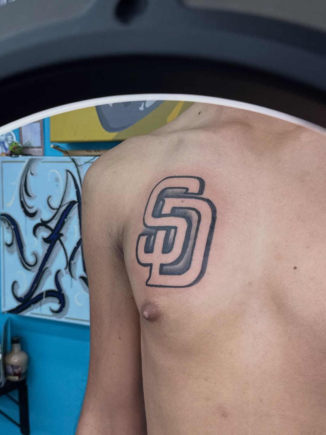 SD logo tattoo on the shoulder by ⠀Greave