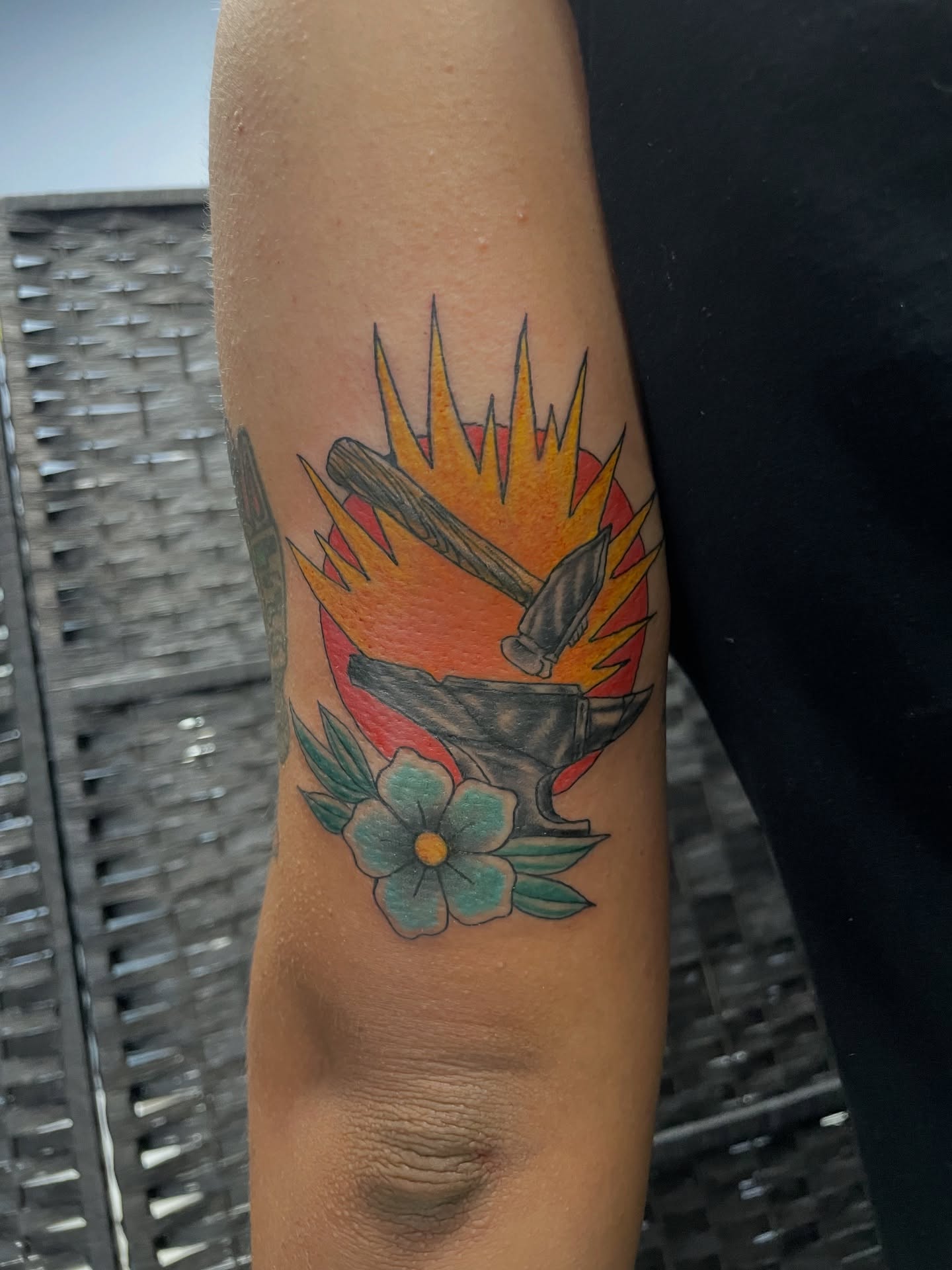 Hammer and flower American traditional tattoo on the forearm by Brittany Brutal