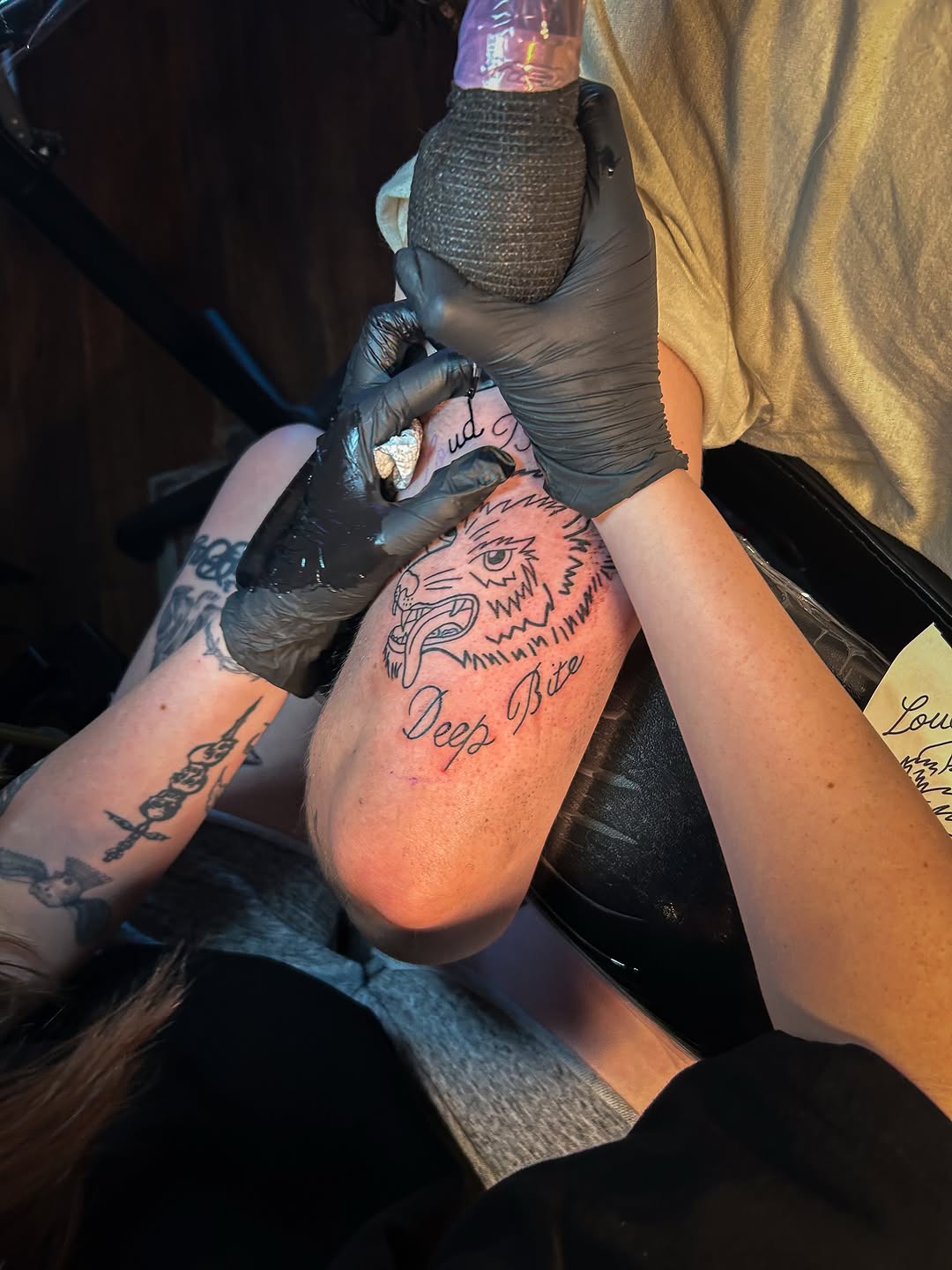 Wolf head and script text tattoo on the forearm by Andres Flores