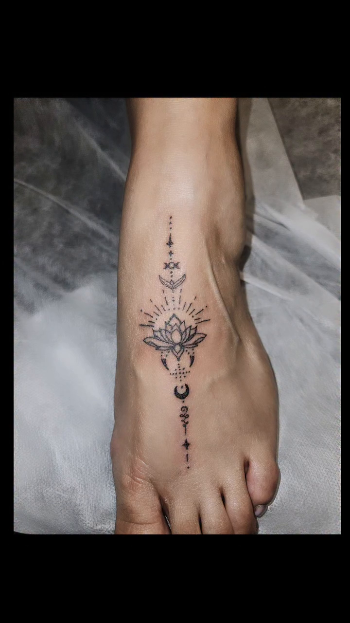 Ornamental tattoo on the foot by Mischief π€