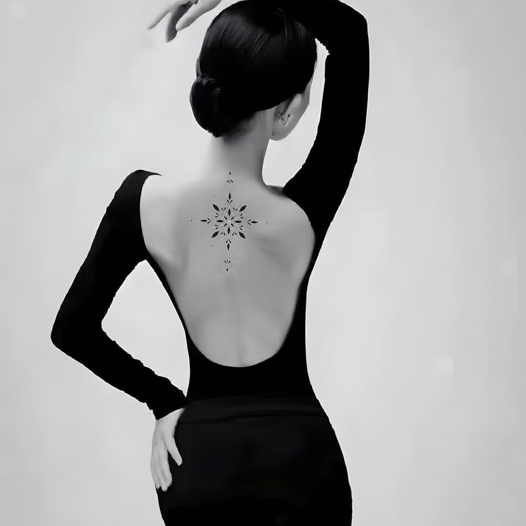 Geometric starburst ornamental tattoo on the back by Joey tattoo