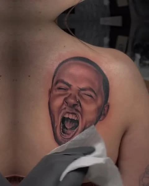 Portrait of a man screaming realism tattoo on the shoulder by Magdalena Davis