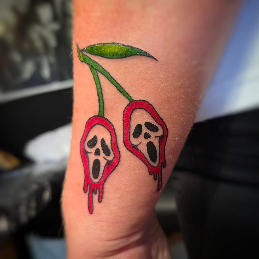 Cherries with ghost faces realism tattoo on the forearm by Jam ⚡️🐉🖤