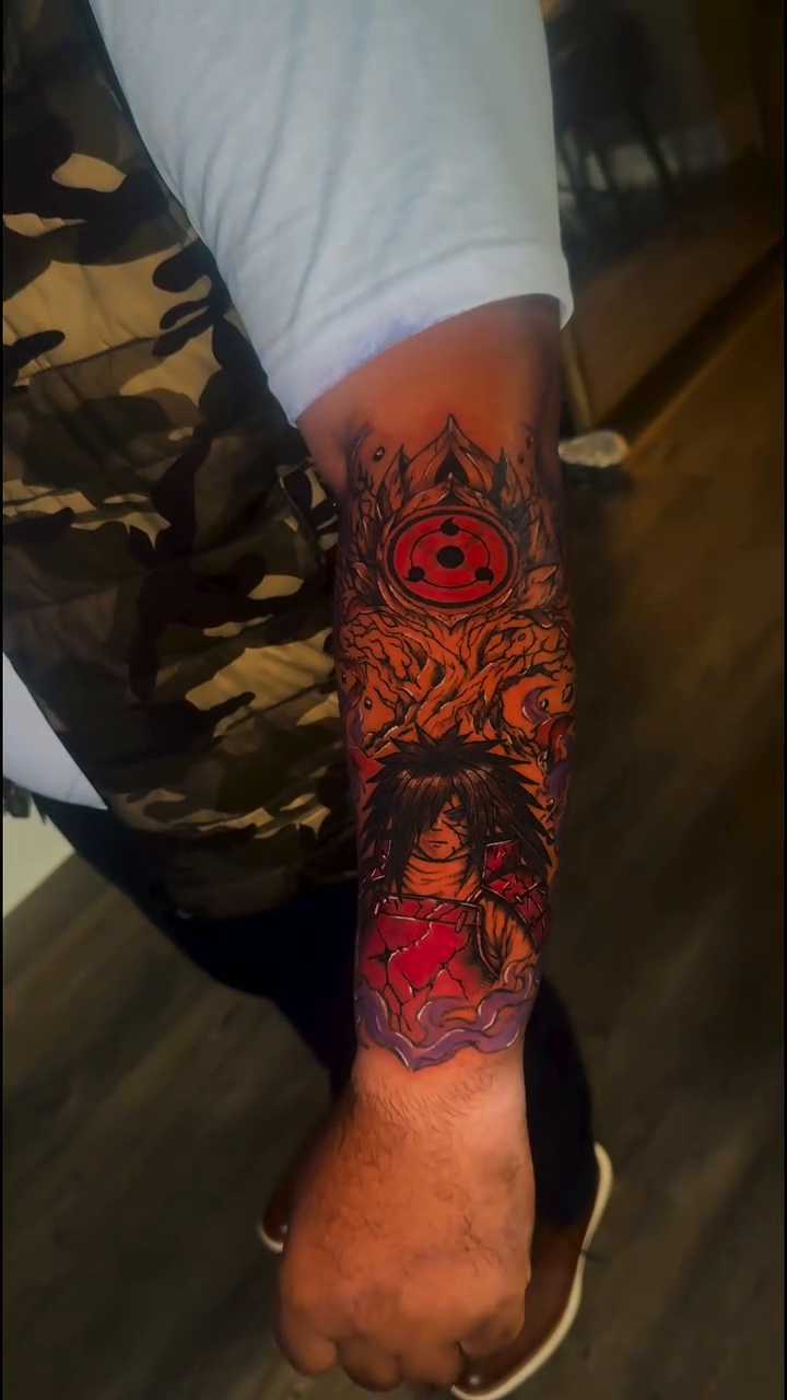 Naruto characters and symbols anime tattoo on the forearm by InkedByJide Tattoo, Atlanta, Georgia