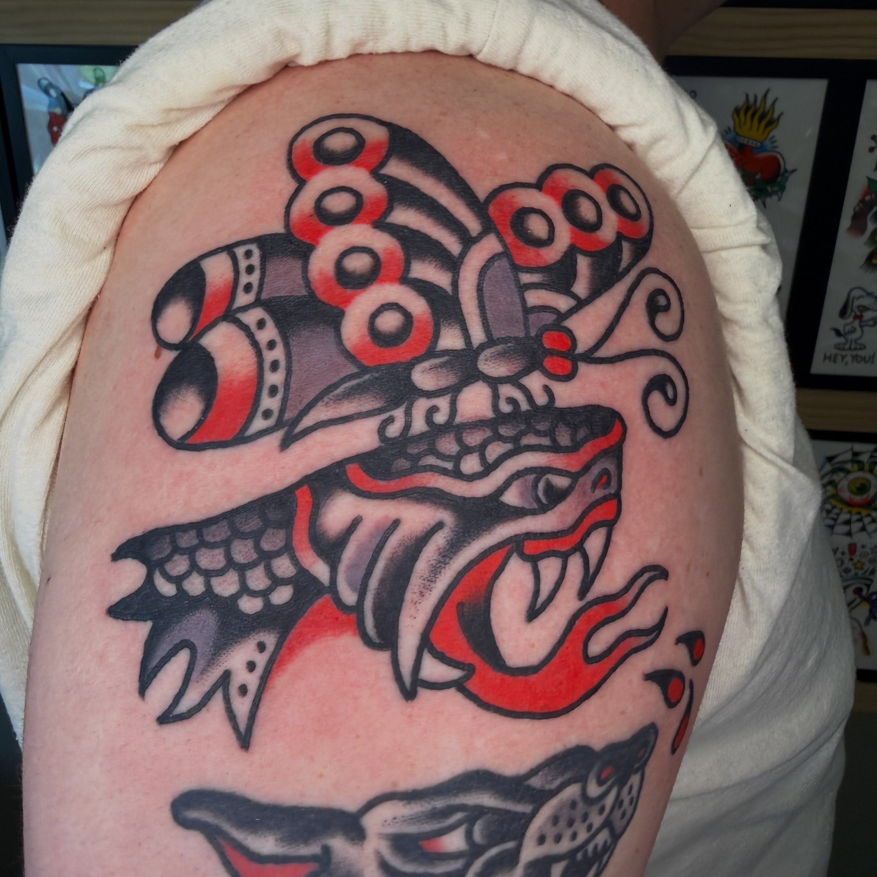 Lion head American traditional tattoo on the shoulder by Tyler