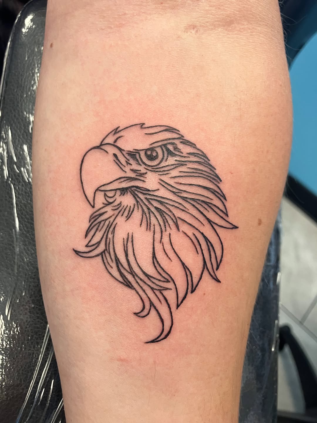 Eagle head fine line tattoo on the forearm by Bryant Johnson