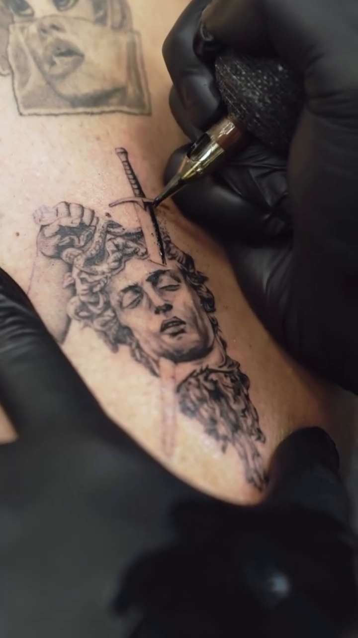 Tattoo by @kidneedle_tattoo — realism, black_and_grey