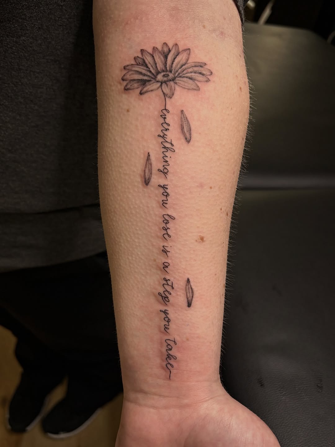 Flower and quote lettering tattoo on the forearm by Francesca Siwa