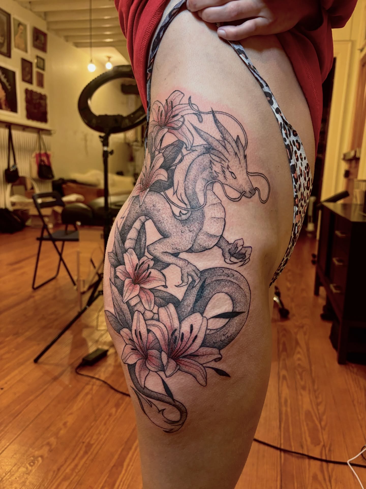 Dragon and lilies realism tattoo on the thigh by V ☆ Cincinnati Tattoo Artist