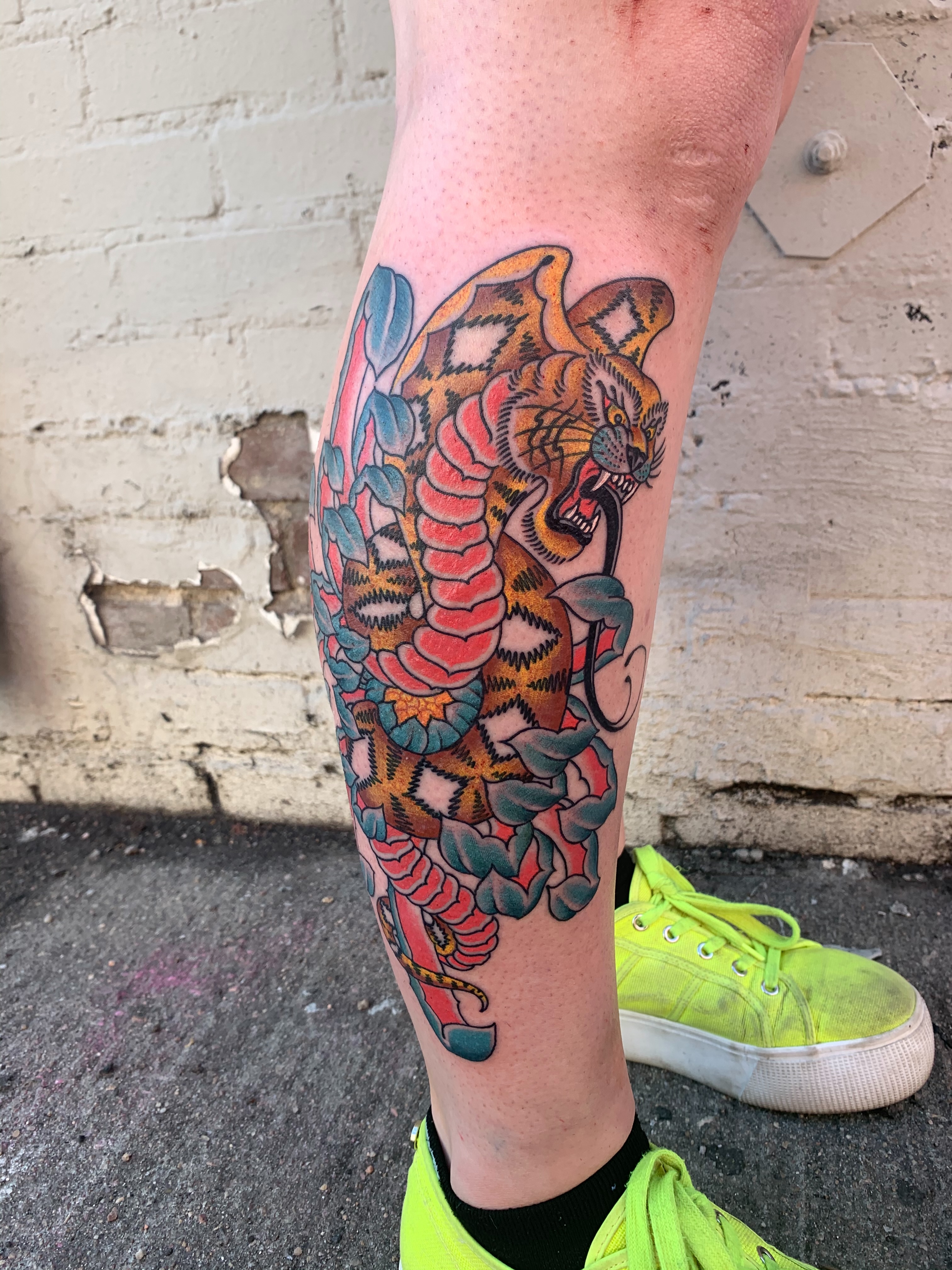 Tiger American traditional tattoo on the calf by Kevin R. Onley