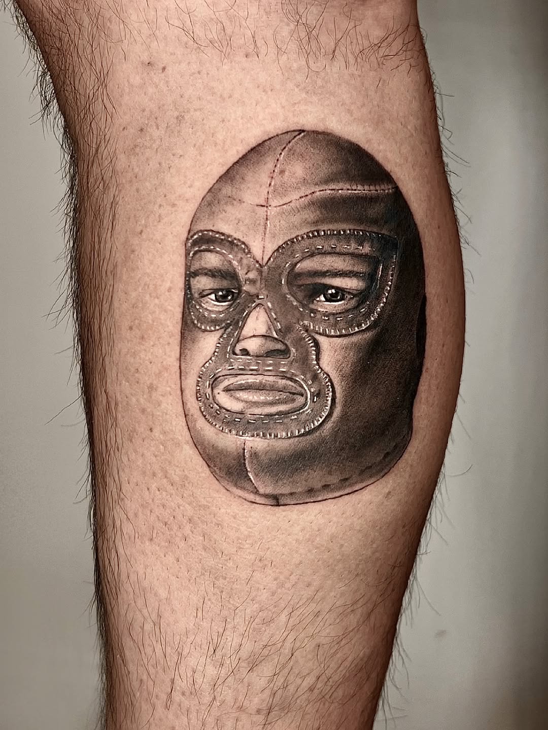 Luchador mask surrealism tattoo on the forearm by Milk Tattoos 🇸🇻🇪🇸