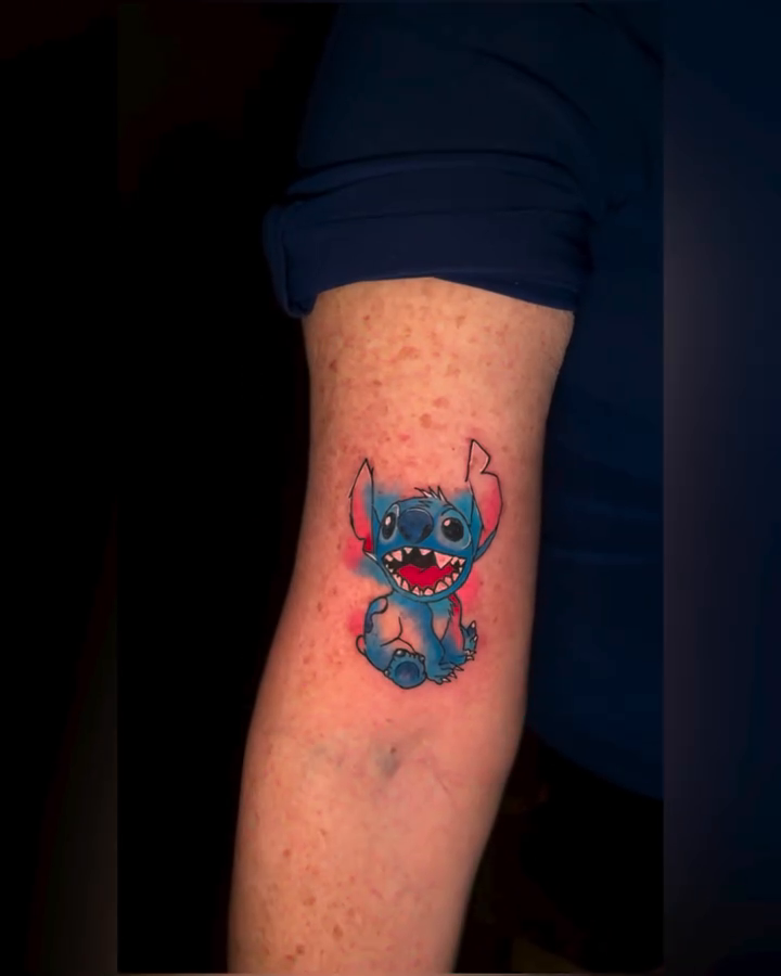 Stitch from Lilo & Stitch new school tattoo on the forearm by Aldocasales@tatto