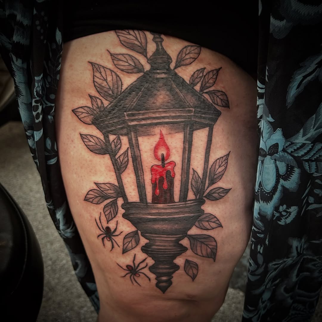 Lantern with candle and spiders minimalist tattoo on the thigh by Gillian