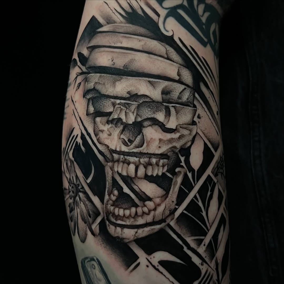 Deconstructed skull realism tattoo on the forearm by Cuda