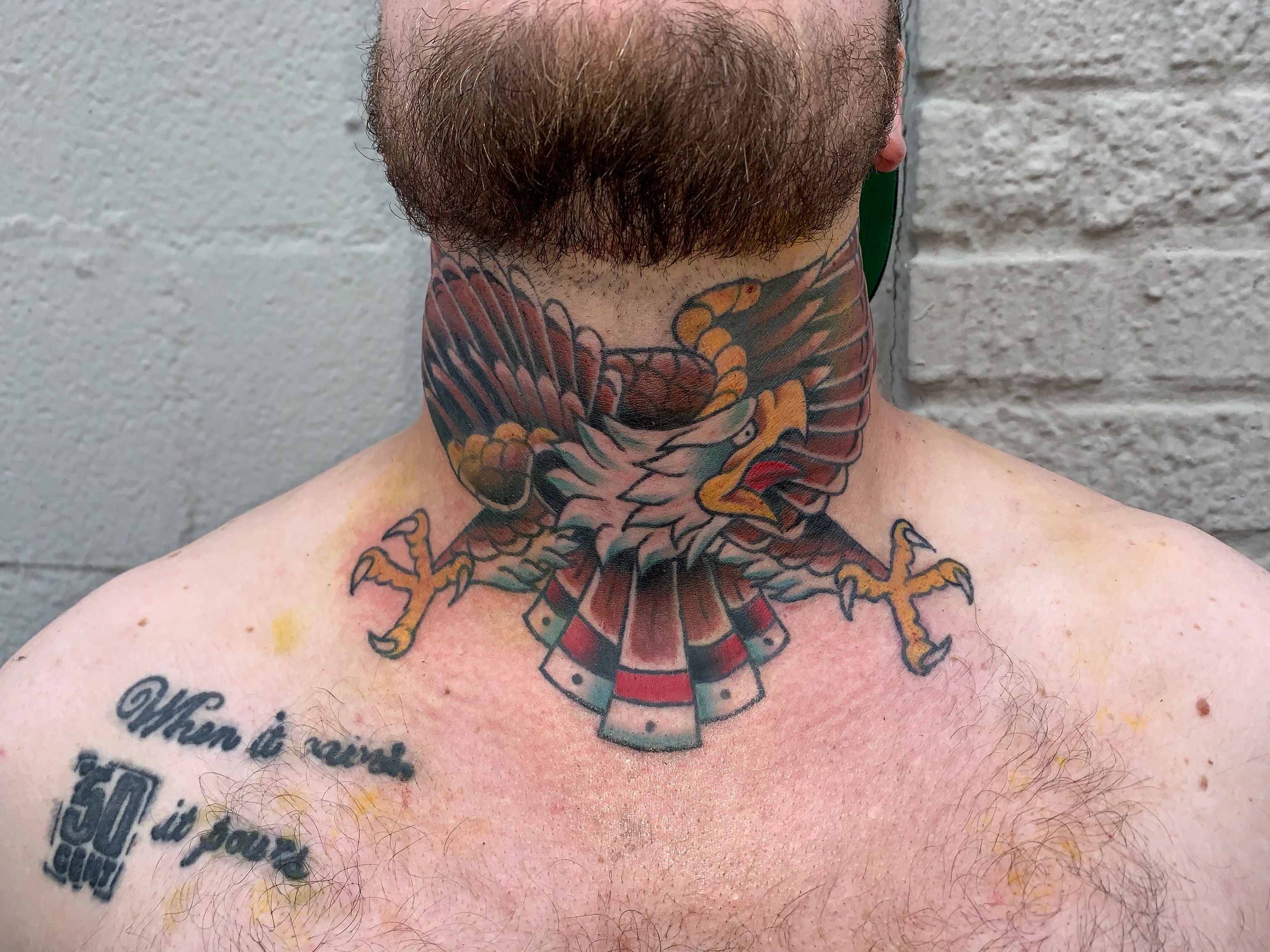 Eagle American traditional tattoo on the neck by Kevin R. Onley