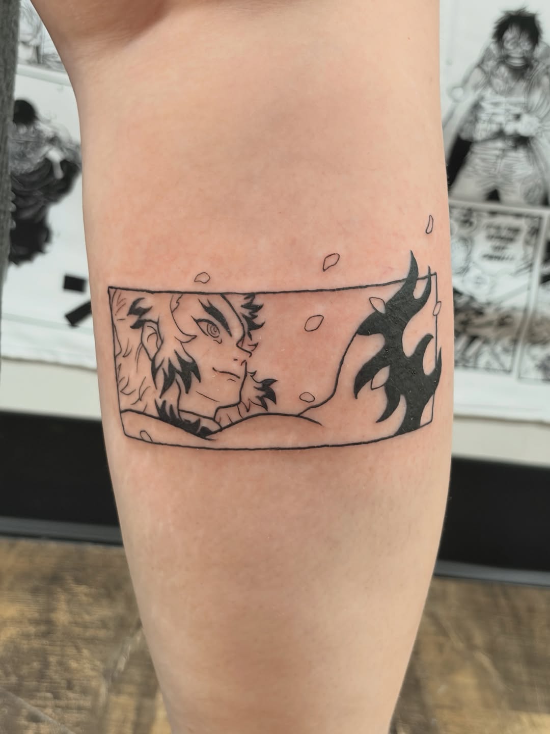 Anime character with flames anime tattoo on the forearm by Chris, Cleveland, Ohio