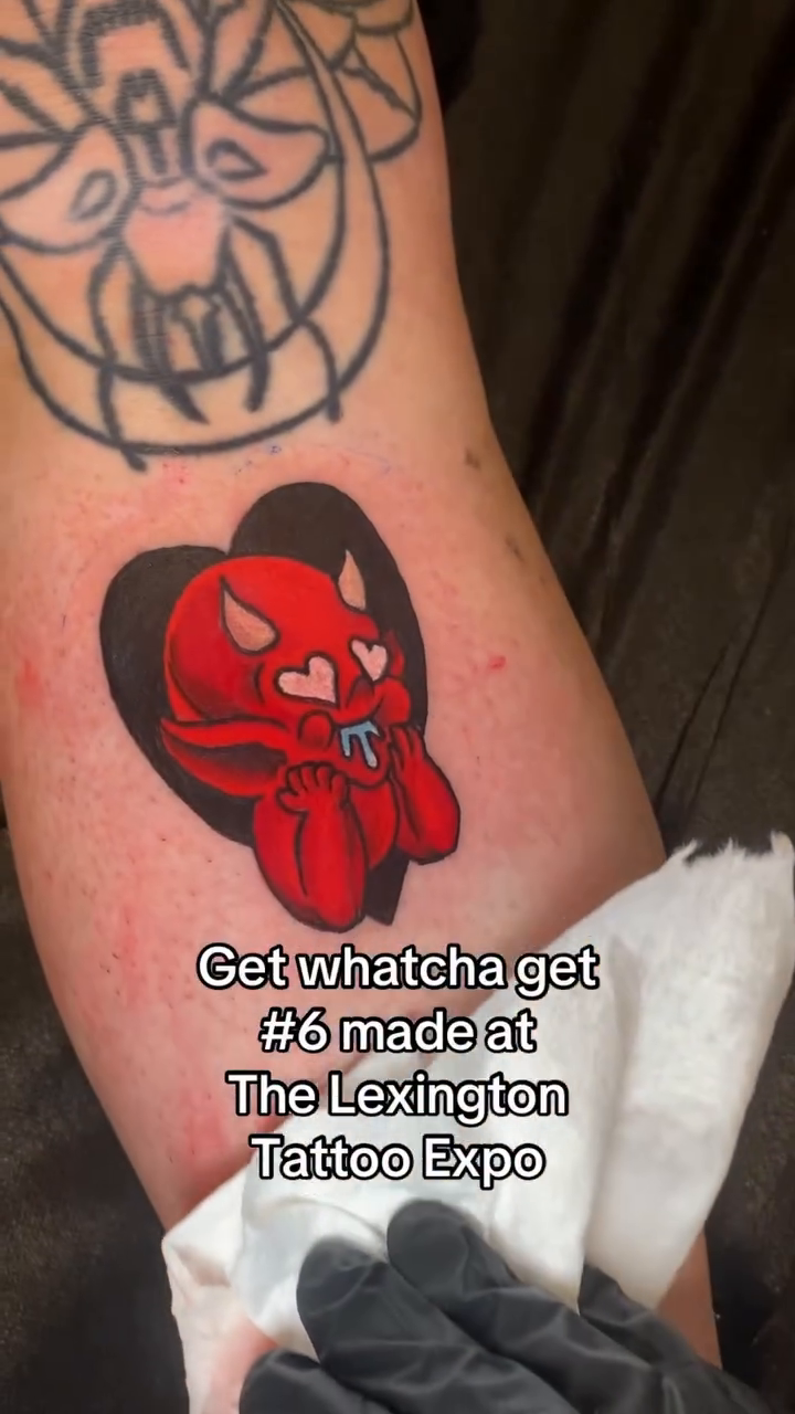 Red devil heart tattoo dark art tattoo on the forearm by Ian Dorman