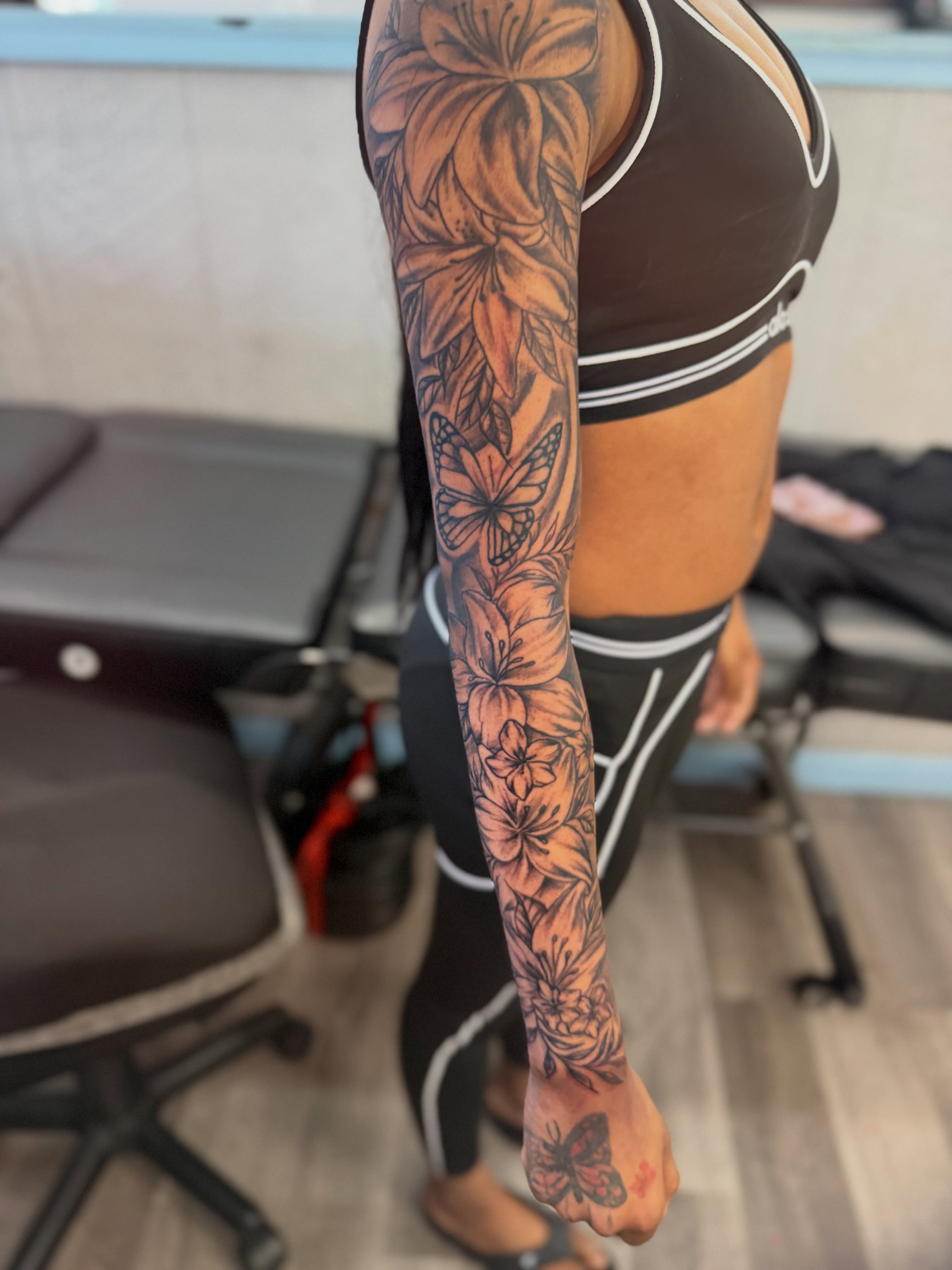 Floral sleeve black and grey tattoo on the upper arm by JAE, Shreveport, Louisiana