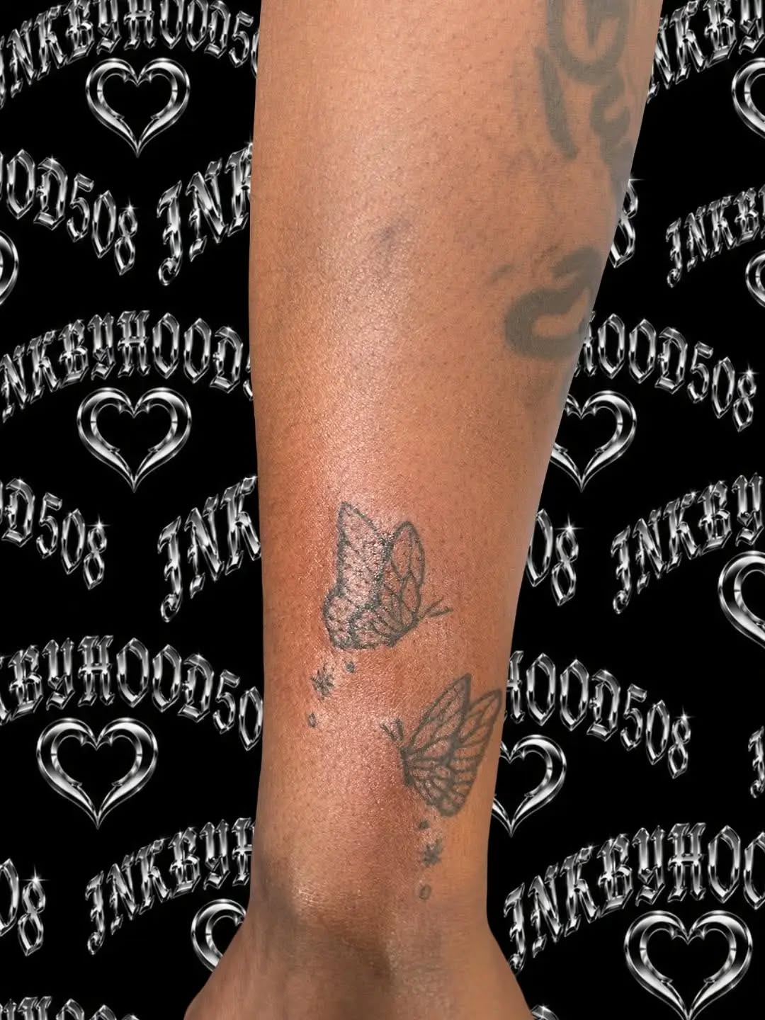 Two butterflies and dots fine line tattoo on the forearm by Hood