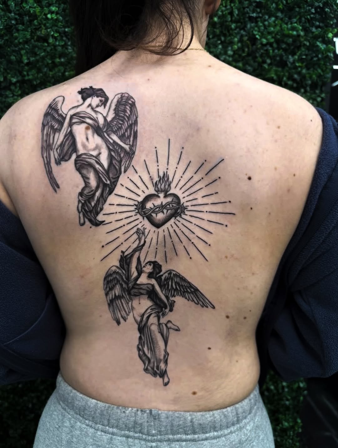 Angels and sacred heart realism tattoo on the back by bella :)