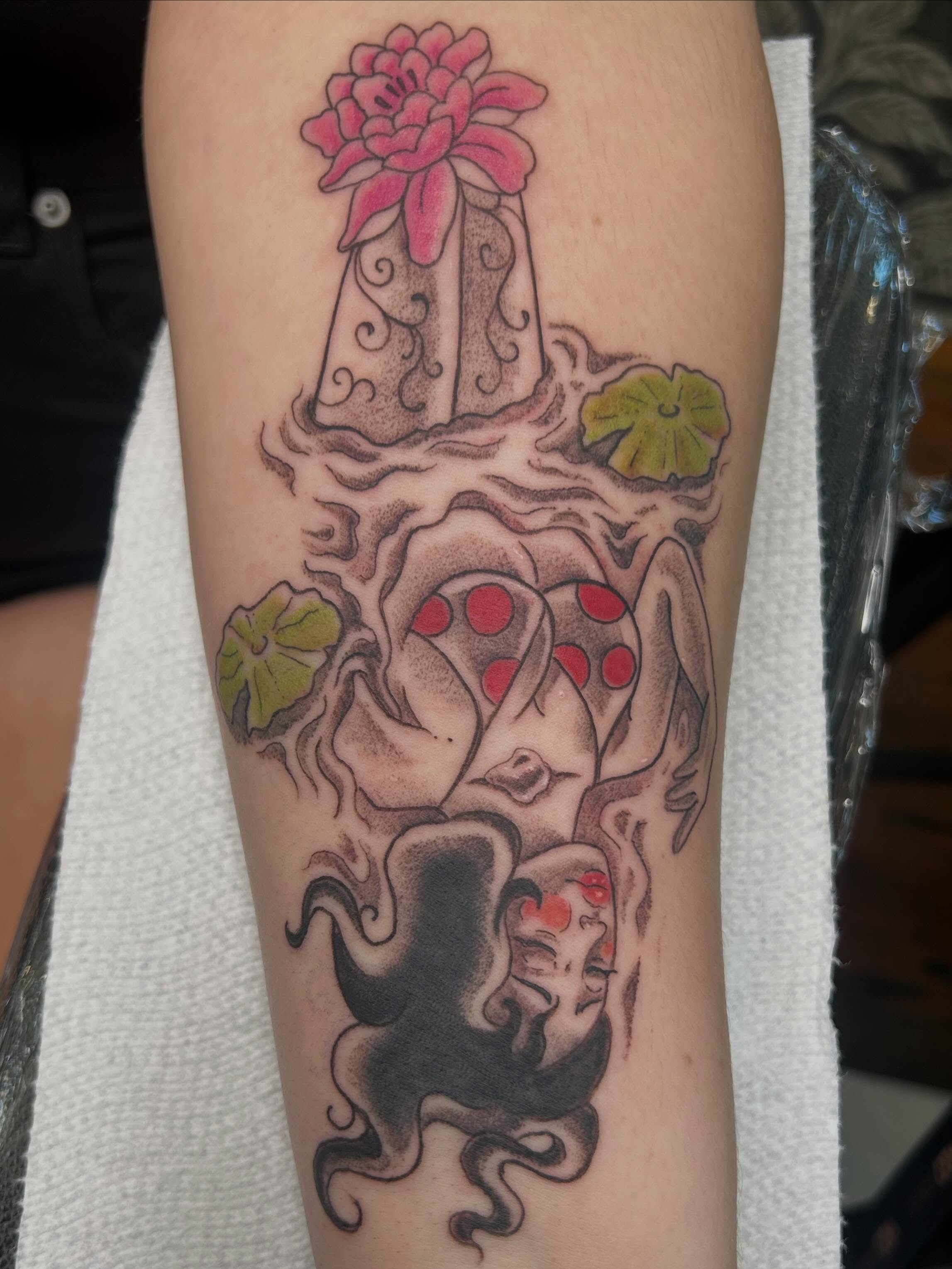 Octopus and flower trash polka tattoo on the forearm by Reilley Earles