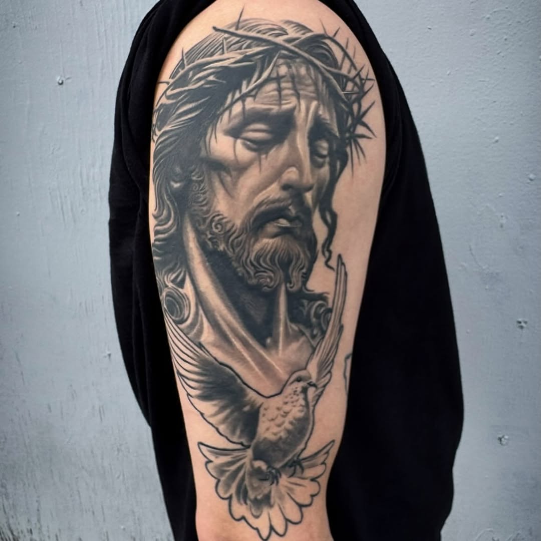 Jesus Christ with a dove Chicano tattoo on the forearm by El Pato, San Jose, California