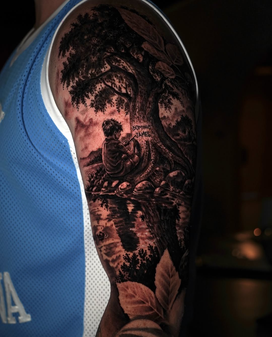 Dark art tattoo on the upper arm by Grace P
