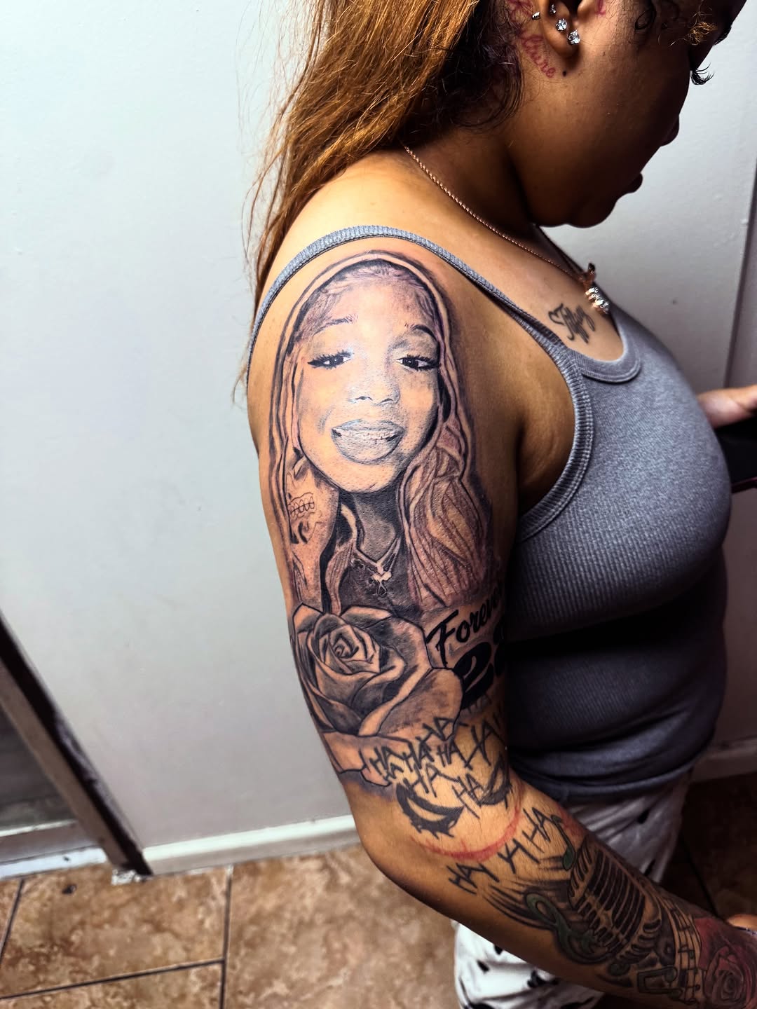 Chicano tattoo on the upper arm by Uncle Fade Tattoo Artist ✍🏾