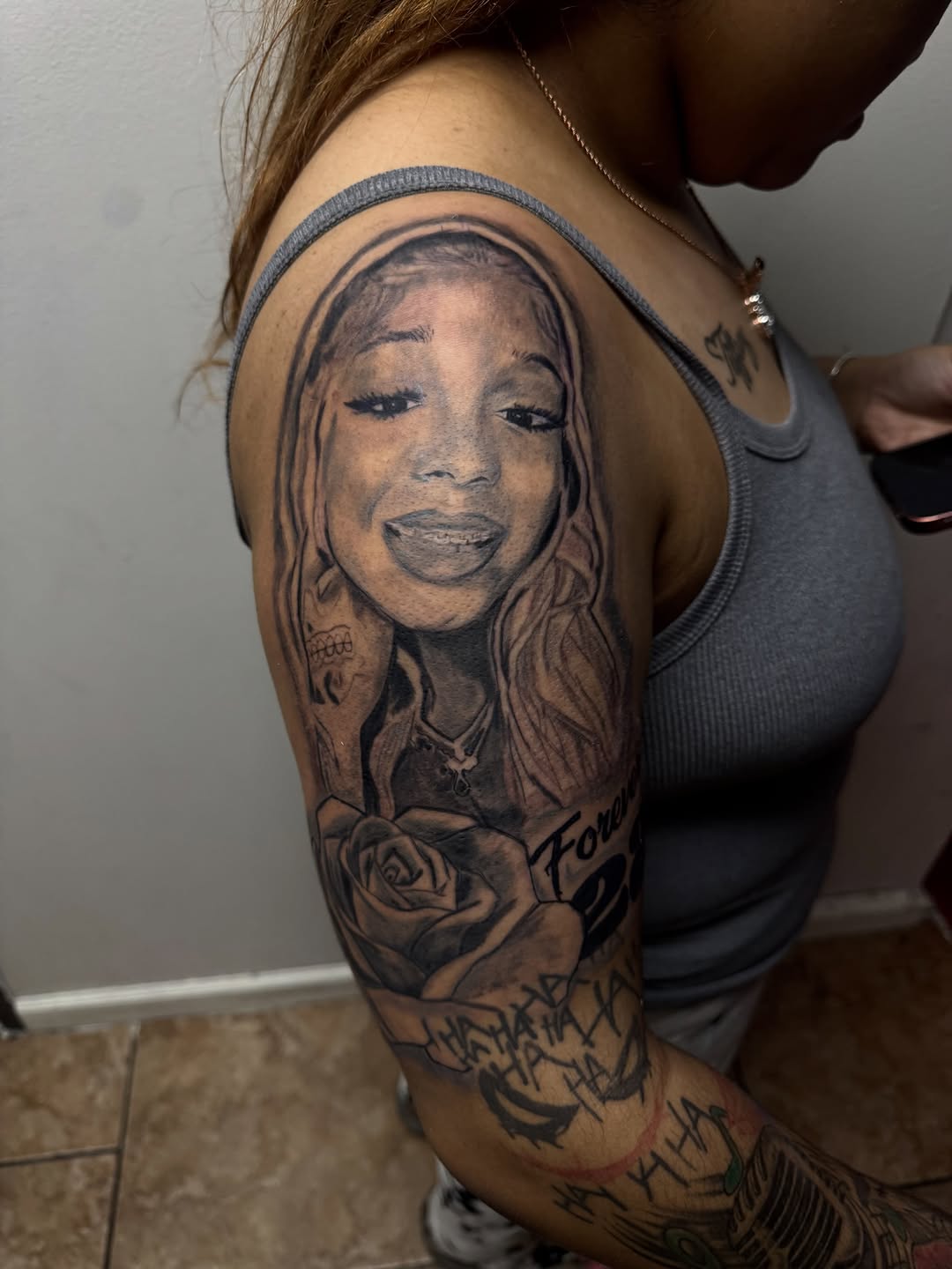 Chicano tattoo on the upper arm by Uncle Fade Tattoo Artist ✍🏾